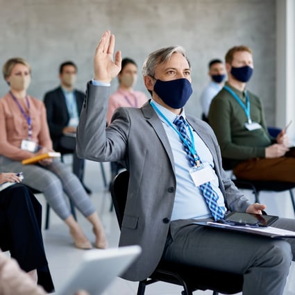 A group attend a seminar while following social distancing and mask-wearing protocols, just two of the more obvious ways the world has changed in recent times. Photo: Shutterstock