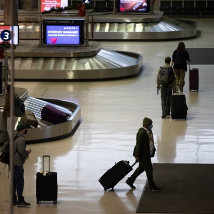 Travellers depart with their luggage at Detroit airport in Michigan, US. Photo: Bloomberg