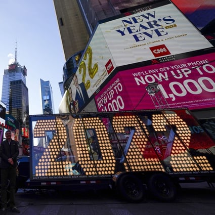 The 2022 sign that will be lit on top of a building on New Year’s Eve is displayed in Times Square, New York, on Monday. Photo: AP