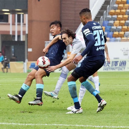 Kitchee’s Jose Paul Urdiales is sandwiched by Rangers’ players during their FA Cup semi-final at Mong Kok Stadium. Photo: K. Y. Cheng