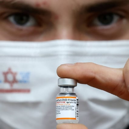 A nurse holds a vial of the Pfizer-BioNtech coronavirus vaccine for children in the Israeli town of Ramat Gan near Tel Aviv on Thursday. Photo: AFP