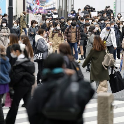 People use a pedestrian crossing in Tokyo’s Shibuya district earlier this month. Photo: AP
