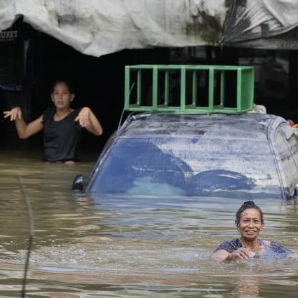 Floods in Malaysia have displaced nearly 70,000 people. Photo: AP