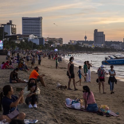 Tourists on Central Pattaya Beach, Thailand, in December. Other than for  arrivals in Phuket, the country suspended its experiment in allowing quarantine-free entry to vaccinated visitors when the Omicron Covid-19 variant became a threat. Photo: Lauren DeCicca/Getty Images