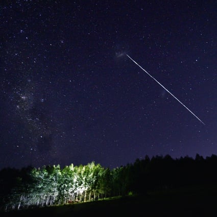 A trail from a group of Starlink satellites, which have been accused of approaching China’s space station. Photo: AFP
