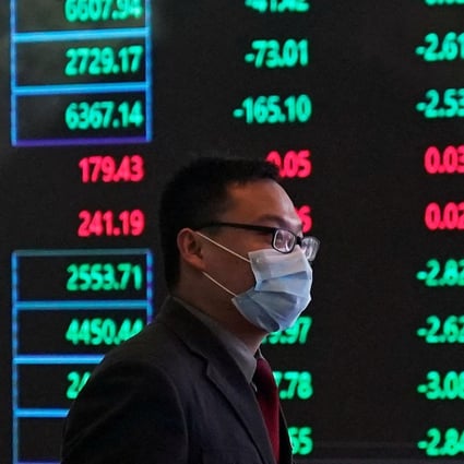 A man wearing a protective mask is seen inside the Shanghai Stock Exchange building. Photo: Reuters 