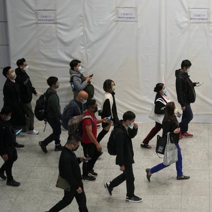 Commuters wearing masks to prevent the spread of the coronavirus disease walk through an MTR station in Hong Kong on December 1. Photo: Reuters 