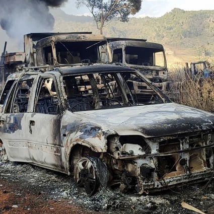 In this photo provided by the Karenni Nationalities Defense Force (KNDF), vehicles smolder in Hpruso township in the Myanmar state of Kayah on December 24 following what witnesses said was an attack by Myanmar troops, who allegedly fatally shot more than 30 villagers and set the bodies on fire. Photo: KNDF via AP