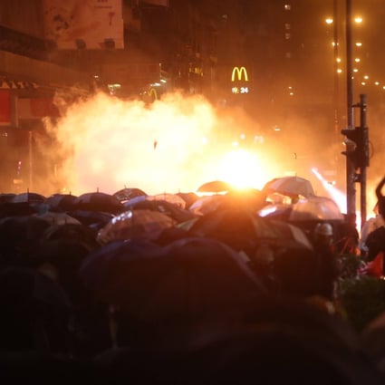 Anti-government protesters clash with riot police on Nathan Road, Yau Ma Tei on November 18, 2019. Photo: Winson Wong