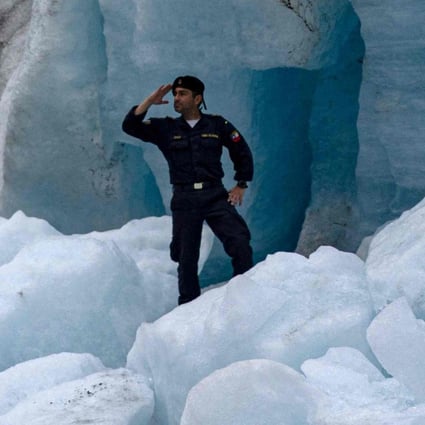 Crew members of the Chilean navy scientific research ship Cabo de Hornos take pictures at the glacier Fouque in the Chile’s Magallanes region on November 30. Photo: AFP