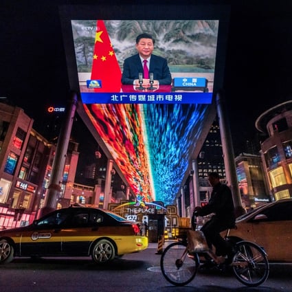 A screen displays a broadcast of President Xi Jinping in Beijing on October 31. Photo: Reuters