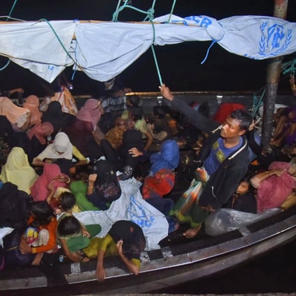 Rohingya refugees arrive in a wooden boat at Krueng Geukueh Port in North Aceh, Indonesia. Photo: AP