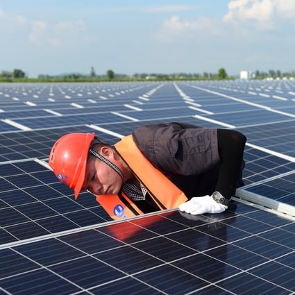 An engineer conducts maintenance work at a floating solar farm in the Panji district of Huainan, Anhui Province, on July 20, 2021. Photo: Xinhua