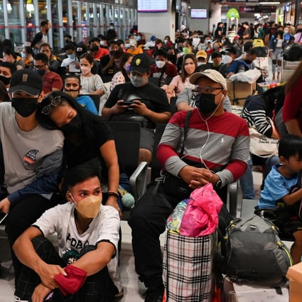 Crowd at a bus terminal in the Philippines where Covid-19 cases are high. Photo: Reuters