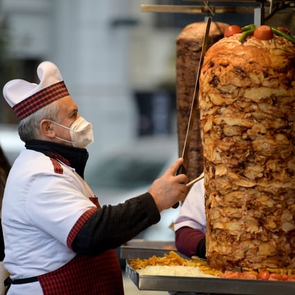 A chef works at a food booth in Istanbul, Turkey, on December 29. Turkey’s annual inflation rate is expected to have hit 30.6 per cent in December, according to a Reuters poll, breaching the 30 per cent level for the first time since 2003 as prices rose due to record lira volatility. Photo: Xinhua