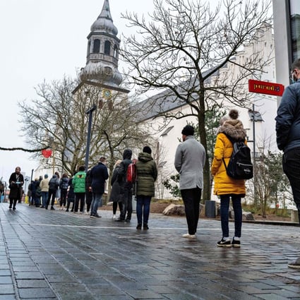 People queue at a coronavirus test centre in Aalborg, Denmark. Photo: AFP
