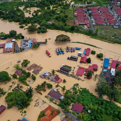 An aerial photo shows the floods in Alor Gajah, Malaysia, on January 1 following heavy rainfall the previous day. There is widespread anger in Malaysia after the failure of flood mitigation systems and a government response seen as inept. Photo: DPA