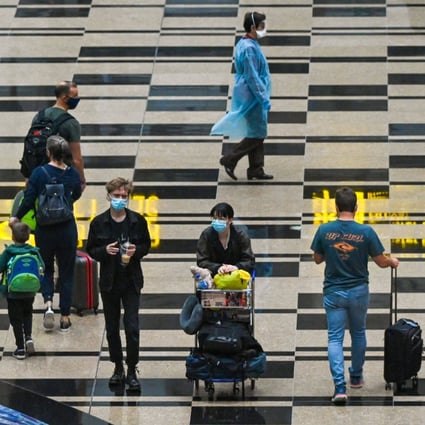 Travellers walk through the transit hall at Changi International Airport in Singapore. Photo: AFP