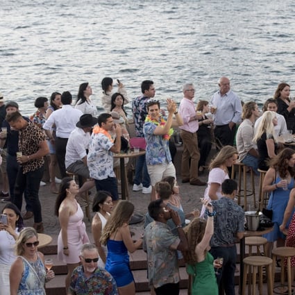 Revellers gather at Opera Bar during New Year’s Eve celebrations in Sydney, Australia. Photo: Bloomberg