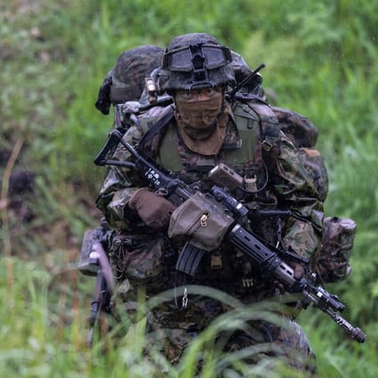A Japanese soldier trains during a joint military drill with French and US forces in May. Photo: Reuters