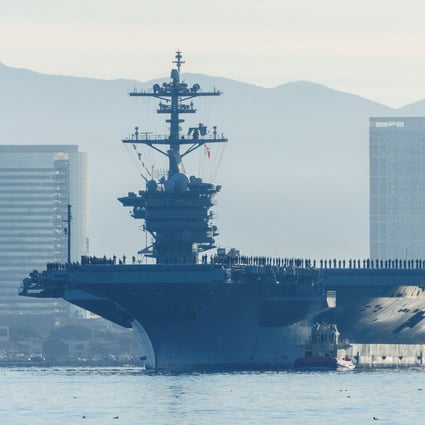 The USS Abraham Lincoln makes history as thousands of service members deploy under Captain Amy Bauernschmidt, the first woman to lead a nuclear carrier. Photo: Reuters
