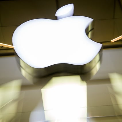 The Apple logo shines on the facade of the Apple Store in Munich, Germany, on February 17, 2016. Photo: dpa
