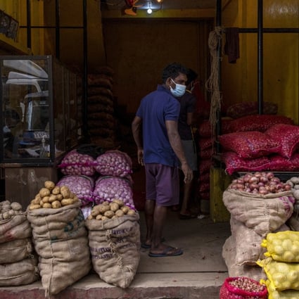 Sacks of potatoes and onions are seen in a store at Pettah Market in Colombo, Sri Lanka. Prices of essential items have surged in the island nation as it runs out of foreign exchange to pay for imports.  Photo: Bloomberg