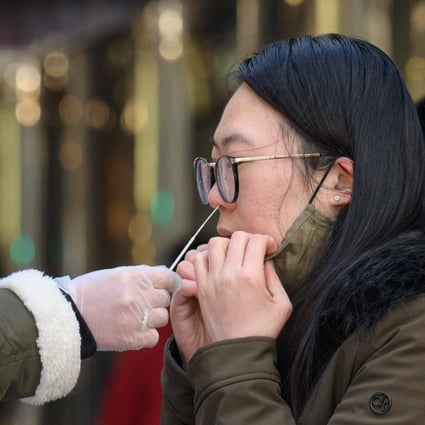 A woman receives a Covid-19 test in New York City. The US recorded more than 1 million Covid-19 cases on January 3, 2022, according to data from Johns Hopkins University. Photo: AFP 