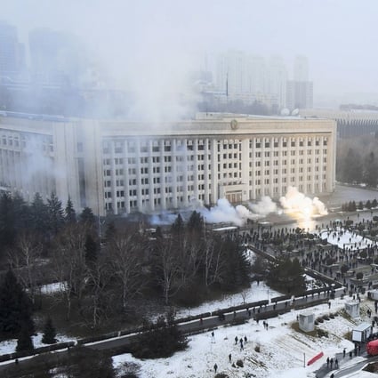Smoke rises from the city hall building during a protest in Almaty, Kazakhstan, on Wednesday. There are reports that protesters angry about rising fuel prices broke into the mayor’s office in the country’s largest city and flames were seen coming from inside. Kazakh news site Zakon said many demonstrators who converged on the building  carried clubs and shields. Photo: AP