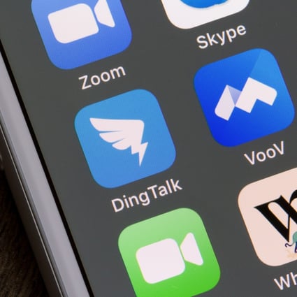 Mobile app icons of DingTalk and VooV, a Chinese video conferencing services owned by Alibaba and Tencent respectively, are seen on a smartphone. Photo: Shutterstock Images
