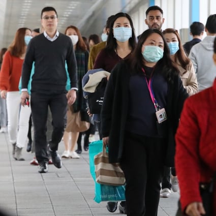 Office workers near HSBC’s headquarters in Central on 21January 2020. Photo: Felix Wong