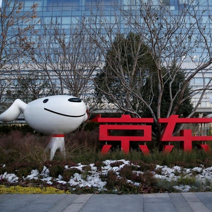 A man stands outside JD.com’s headquarters during an organised tour in Beijing on November 9, 2021. Photo: Reuters