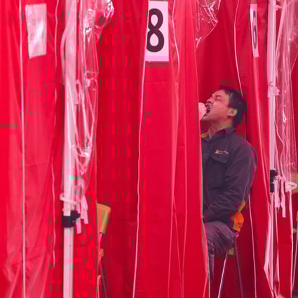 People are tested for Covid-19 at Tsuen Wan Park on Thursday, as a pair of local coronavirus clusters were found to have grown. Photo: K. Y. Cheng