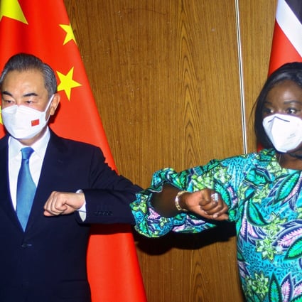 Chinese Foreign Minister Wang Yi and his Kenyan counterpart Raychelle Omamo bump elbows during a news conference in the coastal city of Mombasa, Kenya on Thursday. Photo: Reuters