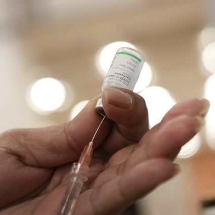 A health care worker prepares a dose of the Sinopharm Covid-19 vaccine. Photo: AP