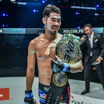 Ok Rae-yoon celebrates his lightweight title win against Christian Lee at ONE: Revolution.