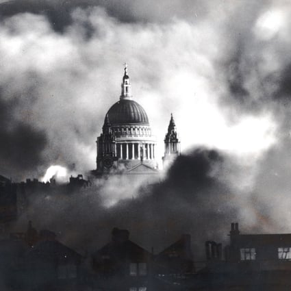 Flames and smoke surround the dome of St. Paul’s Cathedral in London in 1940. The writer’s parents were evacuated from the British capital during WWII. Photo: AP/Daily Mail, Herbert Mason