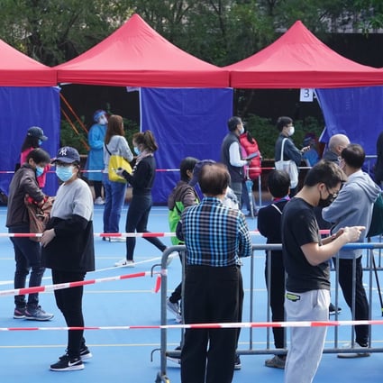 People queue up for Covid-19 testing in Victoria Park, Causeway Bay on Saturday. Photo: Felix Wong