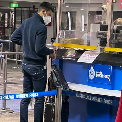 Serbia’s Novak Djokovic, the Australian Open defending champion, waits at an Australian Border Force desk on his arrival at Melbourne Airport on January 5, 2022. Photo: AP