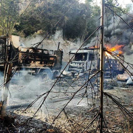 Smoke and flames billow from vehicles in Hpruso on December 24. Myanmar government troops rounded up and shot more than 30 villagers and set their bodies on fire, witnesses said. Photo: Karenni Nationalities Defence Force via AP