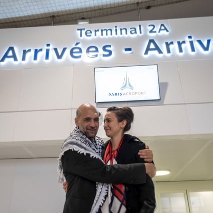 Egyptian-Palestinian political activist Ramy Shaath embraces his wife Celine Lebrun-Shaath at Paris Charles de Gaulle Airport on January 8. Photo: Le Pictorium Agency via Zuma / DPA