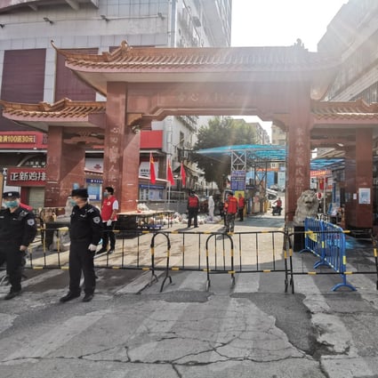 An area under temporary lockdown in Longgang district of Shenzhen, where all three cases live. Photo: Xinhua