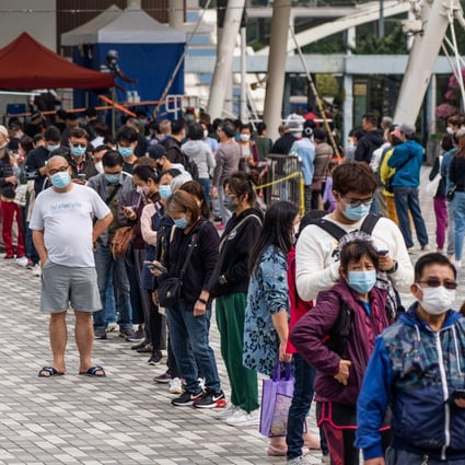 People queue outside a temporary community testing centre which provides free Covid-19 testing in the Wong Tai Sin area of Hong Kong on January 9. Photo AFP