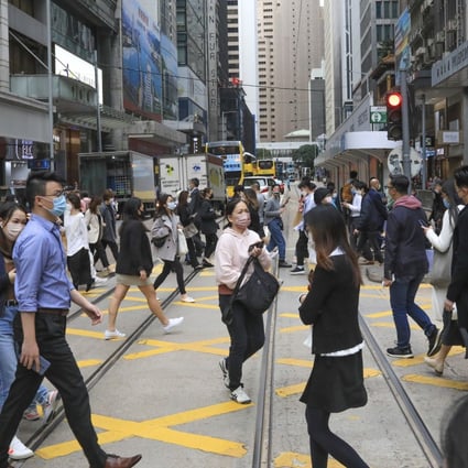 People crossing the street in Central, Hong Kong in December 2021. Photo: Felix Wong