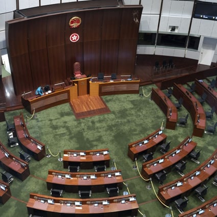 A worker on Monday readies the Legislative Council chamber for the body’s first meeting of its new term later this week. Photo: Robert Ng