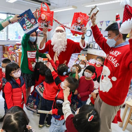Korean International School Hong Kong principal Christopher Chadwick (as Santa) celebrates Santa Fun Day last month at the school in Sai Wan Ho. Photo: May Tse