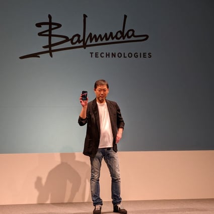 Balmuda CEO Gen Terao, whose company’s design focus was inspired by Apple’s Steve Jobs, holds the ‘Balmuda Phone’ at a news conference in Tokyo in November. Photo: Reuters