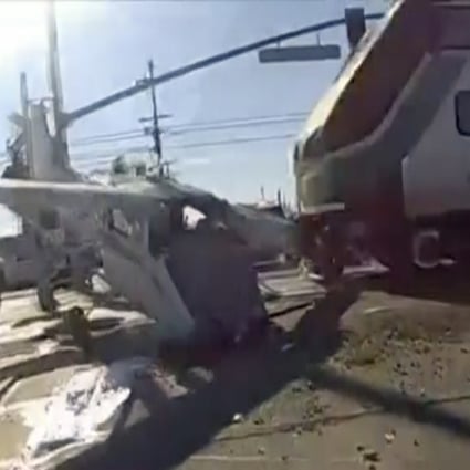 A screengrab from police bodycam footage shows a commuter train running into a plane that crash-landed in Los Angeles on Sunday. Photo: Los Angeles Police Department via AP