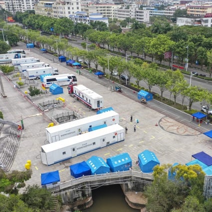 Mobile Covid-19 laboratories underline the state of alert in Dongxing, on the Vietnam border. Photo: Xinhua