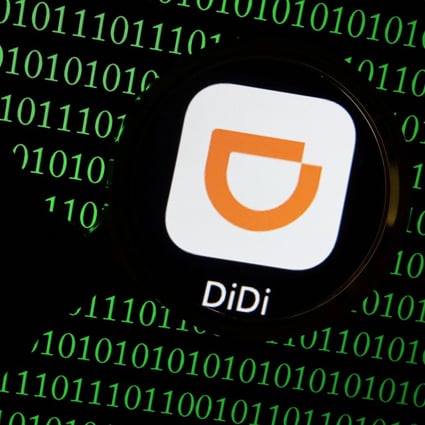 The app logo of Chinese ride-hailing giant Didi seen through a magnifying glass on a computer screen showing binary digits in this illustration picture taken July 7, 2021. Photo: Reuters
